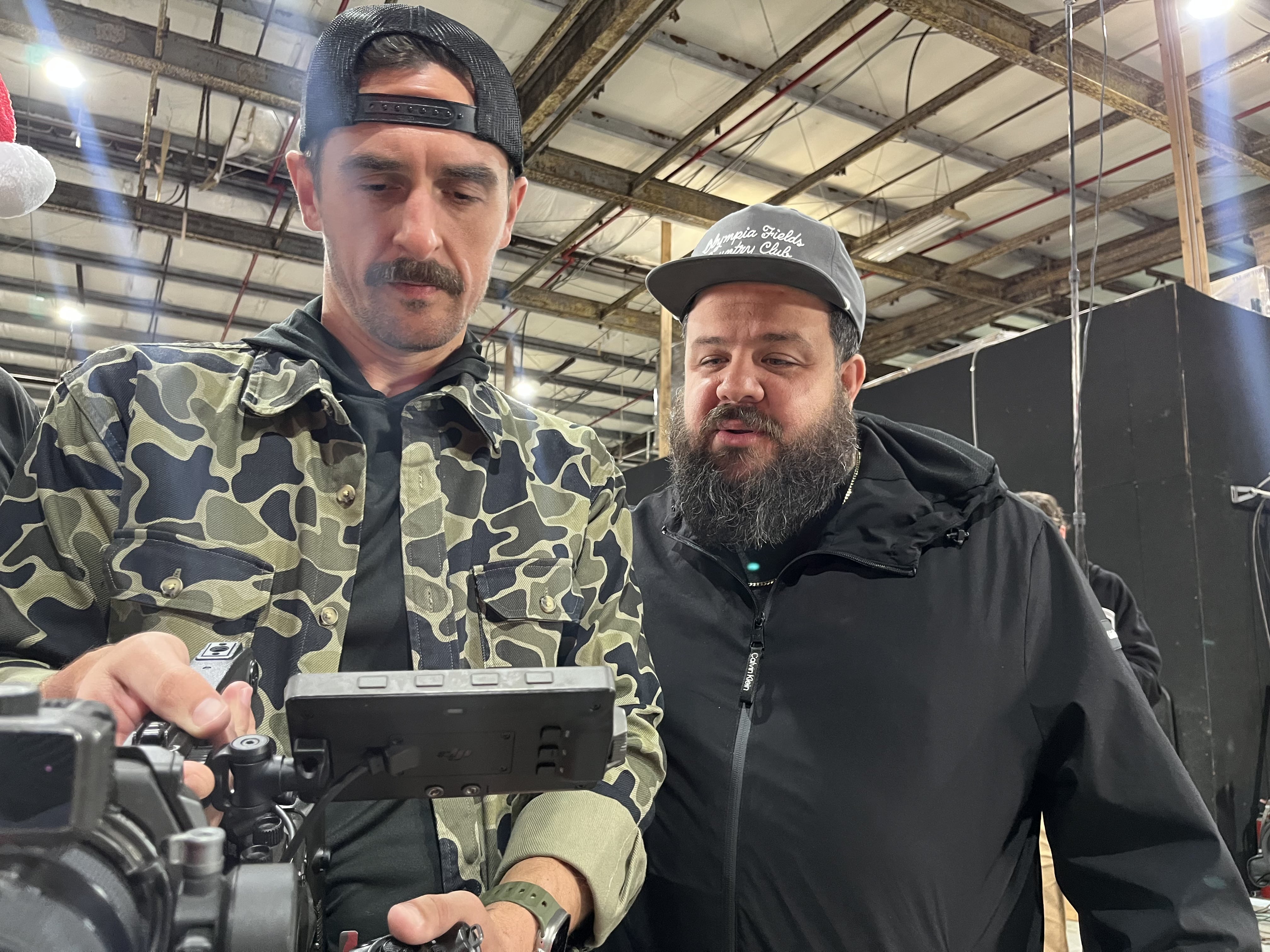 Crew reviewing a camera monitor on the BMW Lifestyle set.