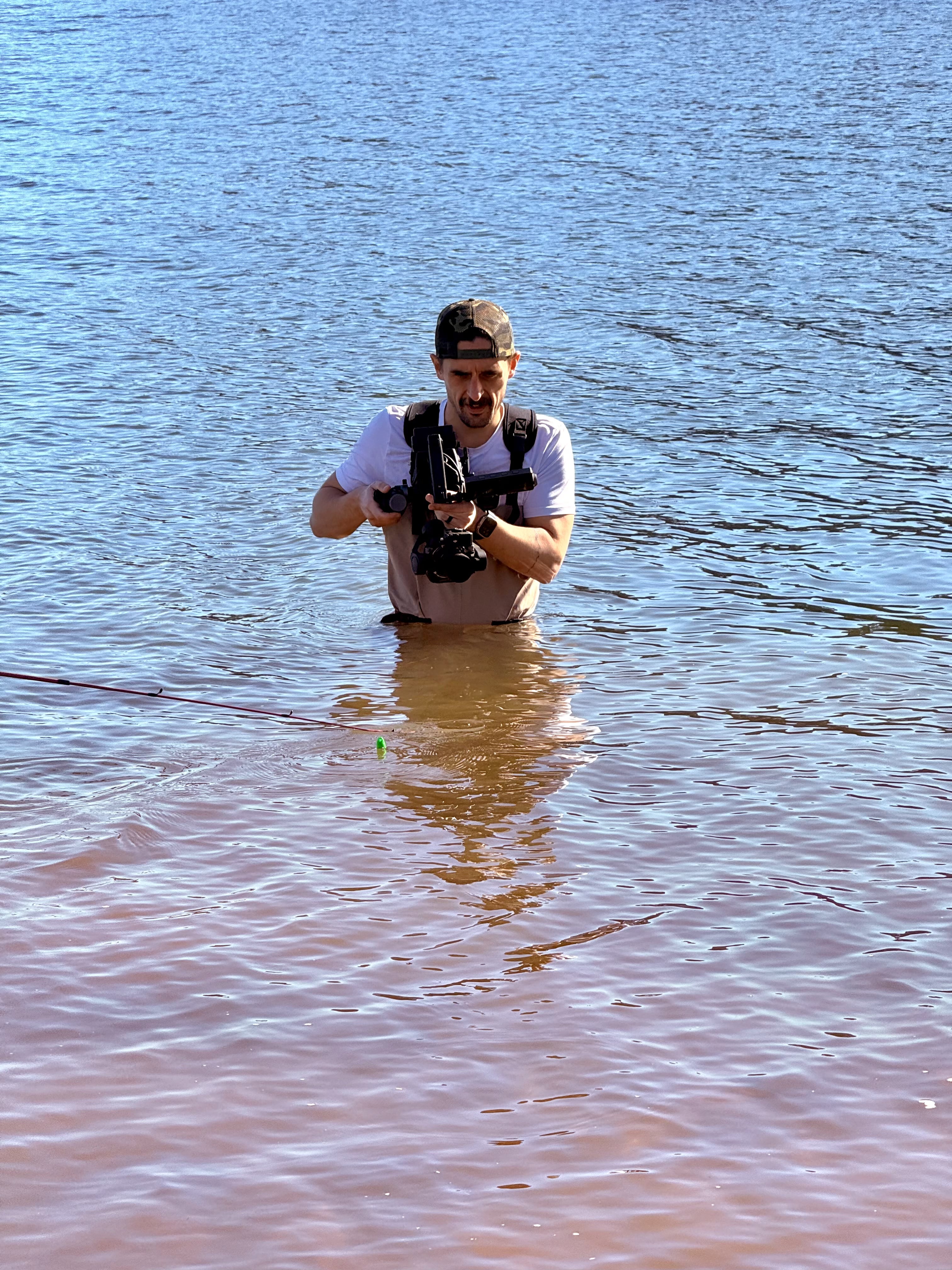 Camera operator filming in the water during the BMW Lifestyle location shoot.